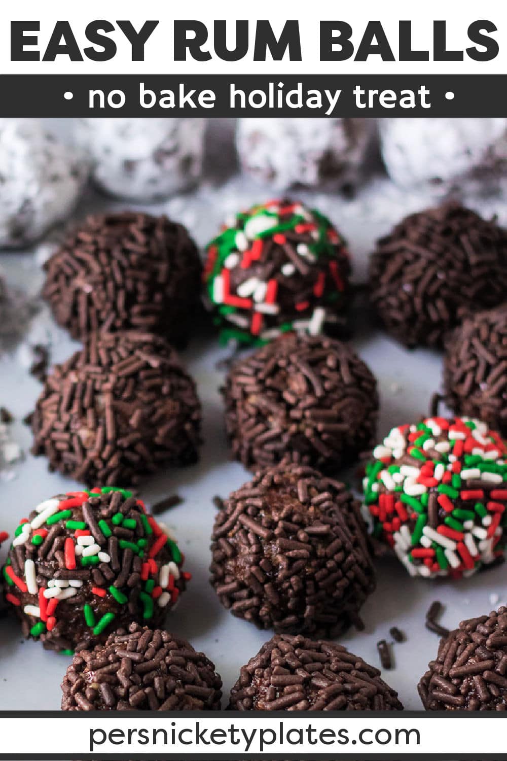 Traditional rum balls are an easy, no-bake holiday staple. Vanilla wafers, cocoa powder, pecans, and honey come together with powdered sugar and sprinkles to give them a sweet, chocolatey, nutty flavor, with a kick of rum! | www.persnicketyplates.com