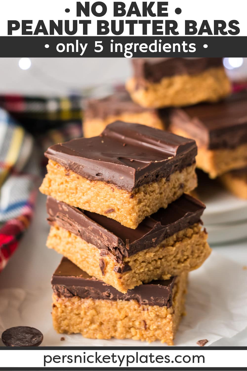 These no bake chocolate peanut butter bars have all the flavors of peanut butter cups in the form of a dessert bar made with just 5 ingredients! With no oven required, these rich and decadent dessert bars come together quickly and easily for the tastiest anytime treat. | www.persnicketyplates.com