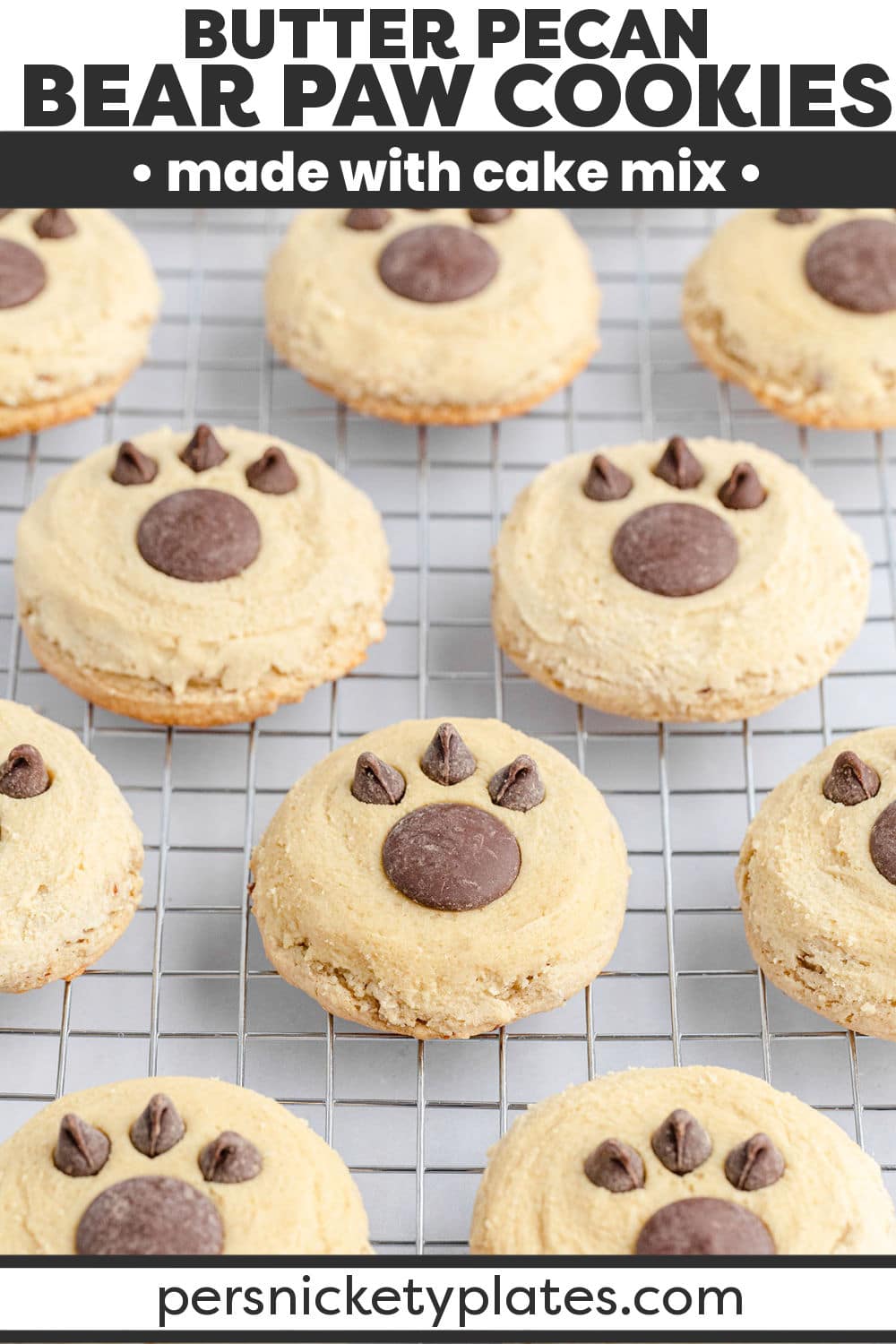 Bear paw cookies are made with a butter pecan cake mix and chopped pecans for added texture. These soft and chewy cookies are topped with a sweet maple frosting and adorned with chocolate candy melts and chocolate chips for the paw print! | www.persnicketyplates.com