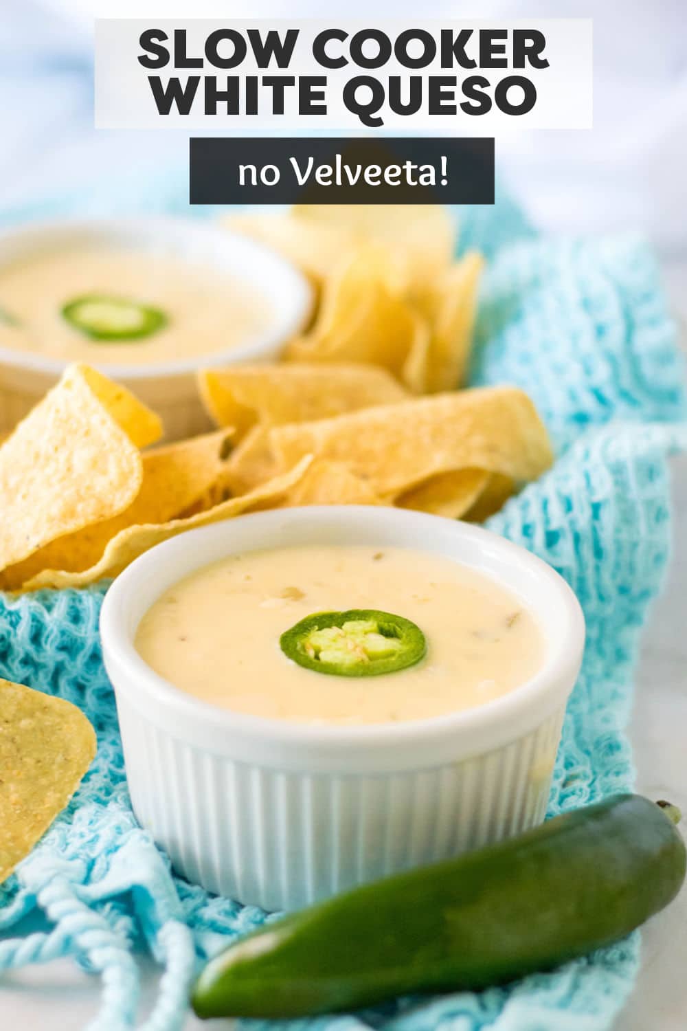 Slow Cooker Queso Blanco (aka white queso dip) is made with just four ingredients and no Velveeta! Restaurant quality made in just minutes in the crockpot. | www.persnicketyplates.com