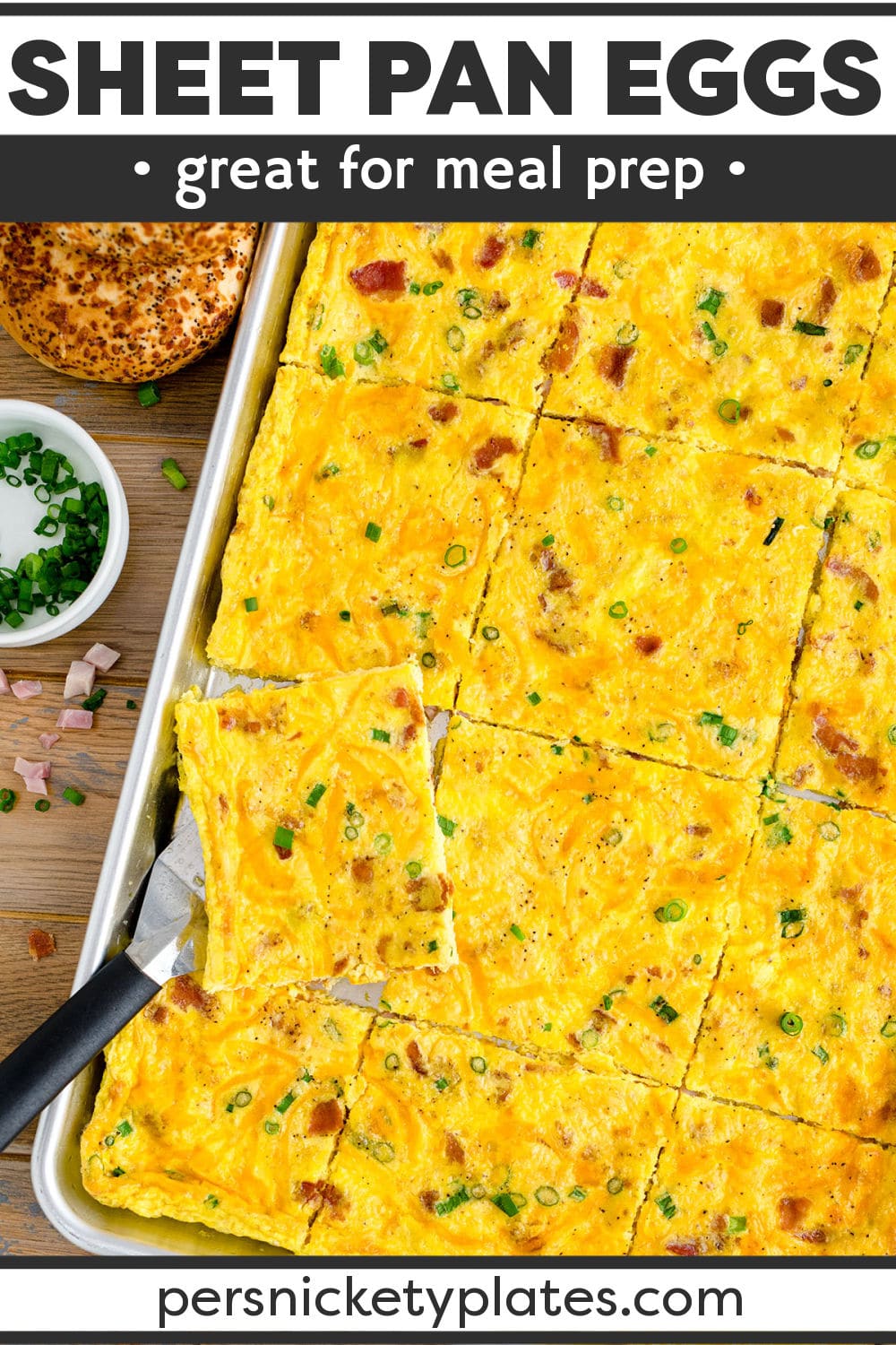 This sheet pan eggs recipe is perfect for serving a crowd or for meal prep. It's made with eggs, bacon, ham, cheese, and onions all baked on one sheet in under 30 minutes. | www.persnicketyplates.com