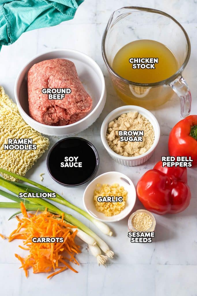 overhead shot of labeled ingredients laid out to make ramen noodles with ground beef.