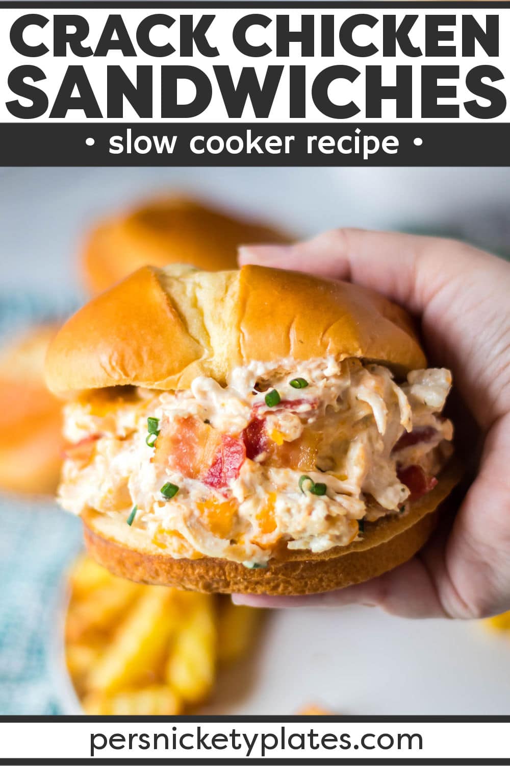 Slow Cooker Chicken Bacon Ranch Sandwiches (aka Crack Chicken) are an easy hit!  Chicken, cream cheese, and ranch seasoning cook together in the crockpot before getting mixed with cheddar, bacon, and scallions and then piled onto soft buns. | www.persnicketyplates.com