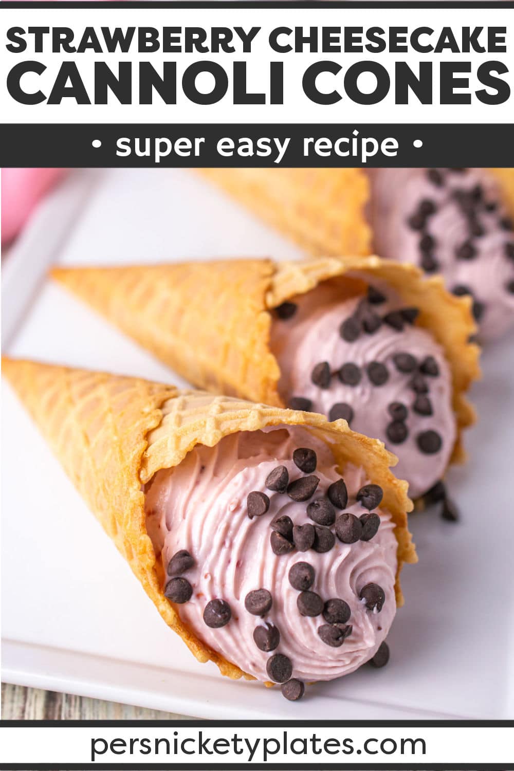 These strawberry cannoli cones are a fun twist on traditional cannoli that everyone will love! Waffle cones replace cannoli shells and are then filled to the brim with a sweet ricotta cheesecake filling that’s rich, delicious, and irresistible! | www.persnicketyplates.com