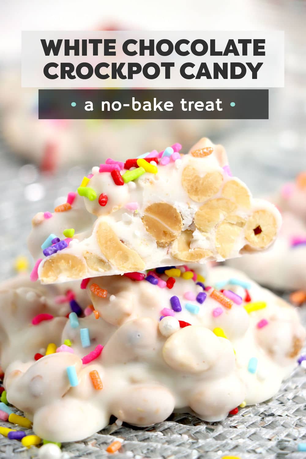 Three ingredient White Chocolate Crockpot Candy is one of the easiest desserts you can make! All you need are some peanuts, white candy melts, and colorful sprinkles for whichever occasion you're celebrating. | www.persnicketyplates.com