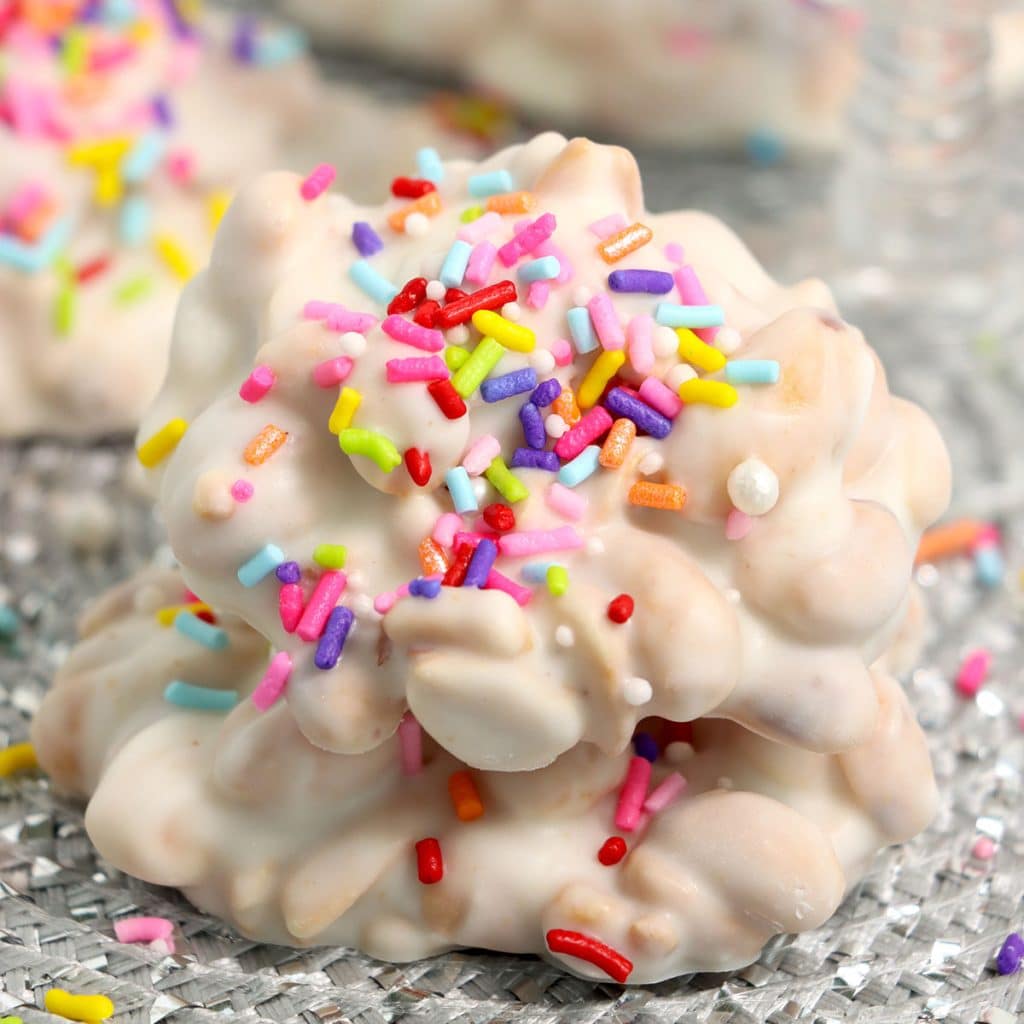 white chocolate crockpot candy with rainbow sprinkles.