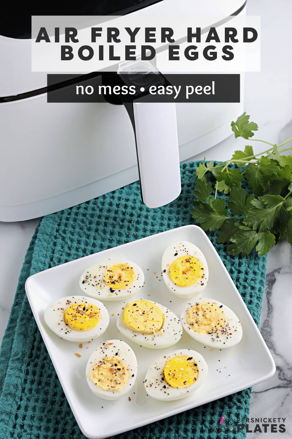 Making Air Fryer Hard Boiled Eggs is my new favorite method to cook a large batch of eggs. This method is quick and easy - no need to babysit a boiling pot. They peel easily and come out perfectly! | www.persnicketyplates.com