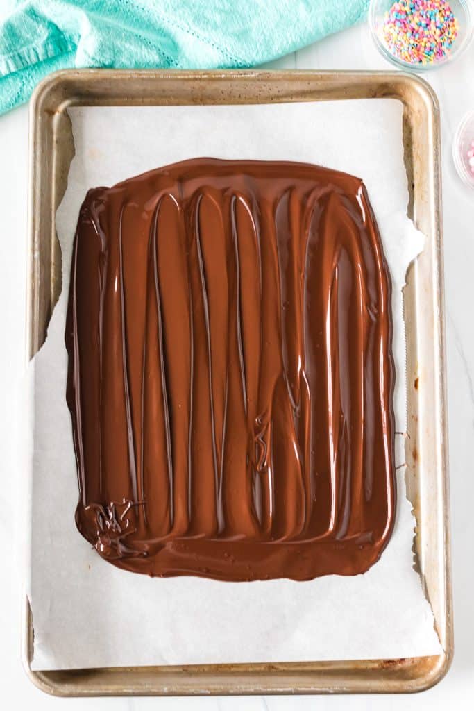 a layer of chocolate spread onto parchment paper.