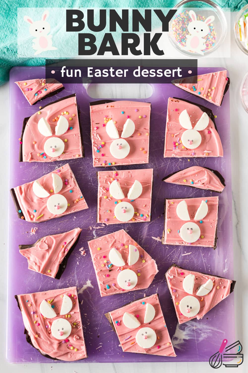 Easy bunny bark is a festive, no-bake Easter treat that starts with a layer of chocolate, topped with a layer of melted pink candy wafers, and decorated with bunnies made out of white candy melts with pastel-colored pearl sprinkle noses. | www.persnicketyplates.com