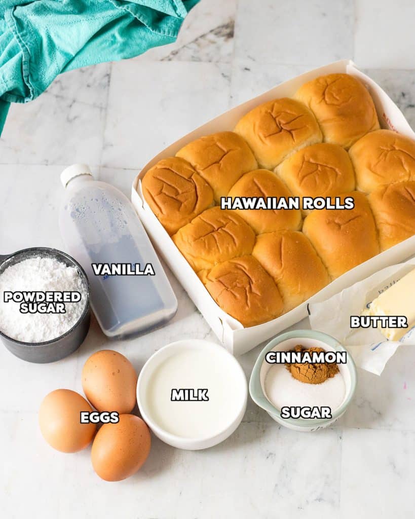 overhead shot of labeled ingredients laid out to make french toast with hawaiian rolls.