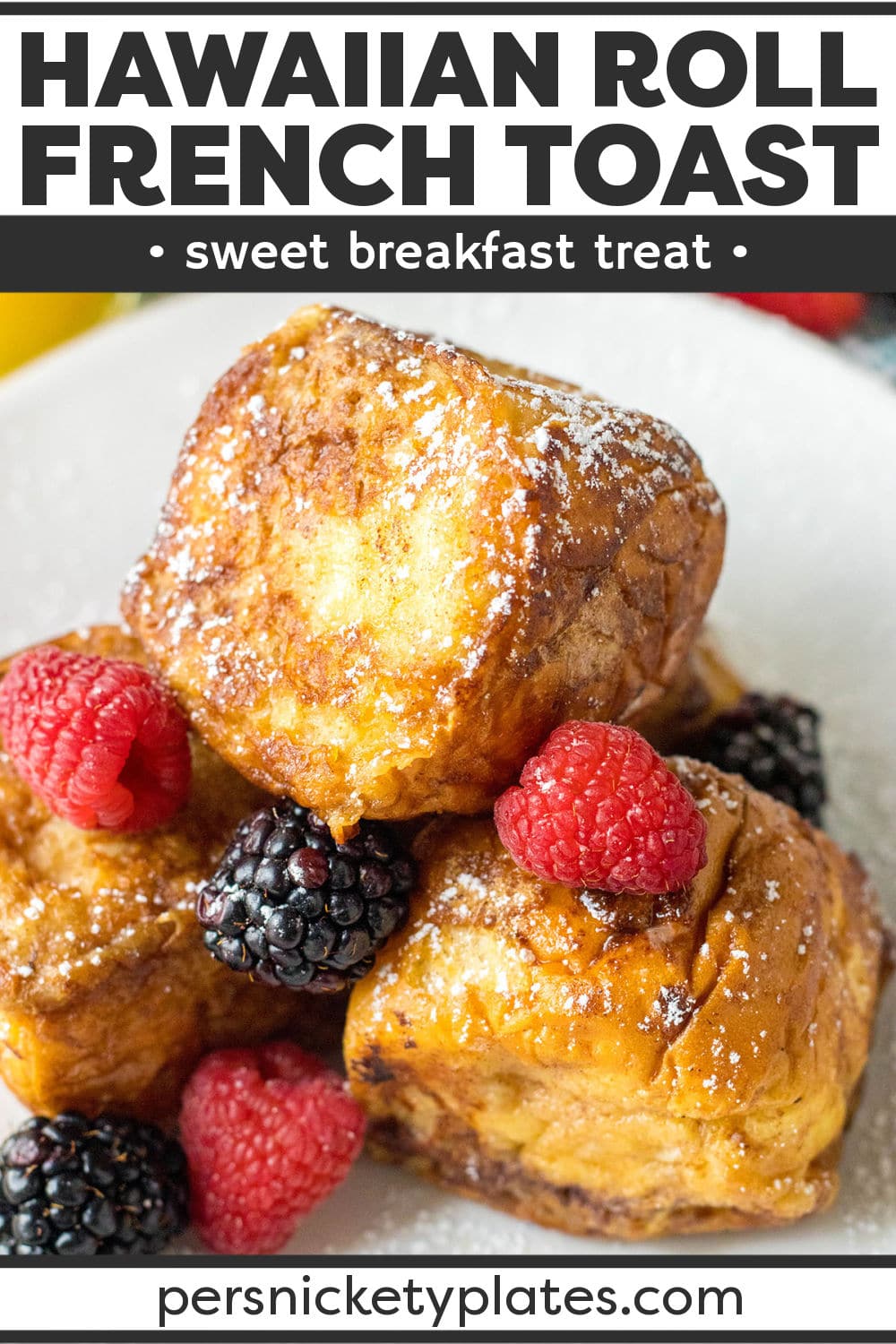 Hawaiian Rolls French Toast is made by soaking sweet hawaiian bread in an egg mixture and then cooking it up until golden brown on all sides. Sprinkled with powdered sugar and paired with fresh berries before serving, this easy breakfast recipe is perfect for brunch, the weekend, or special occasions. | www.persnicketyplates.com