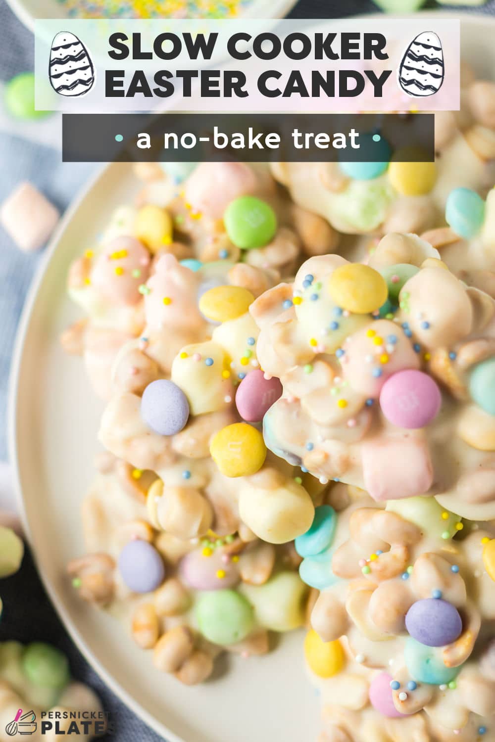 Easy Slow Cooker Easter Candy is classic white crockpot candy flecked with fruit-flavored mini marshmallows, pastel-colored M&Ms, and loaded with roasted peanuts. Topped with festive easter holiday sprinkles, these no-bake treats are always the first to disappear! | www.persnicketyplates.com