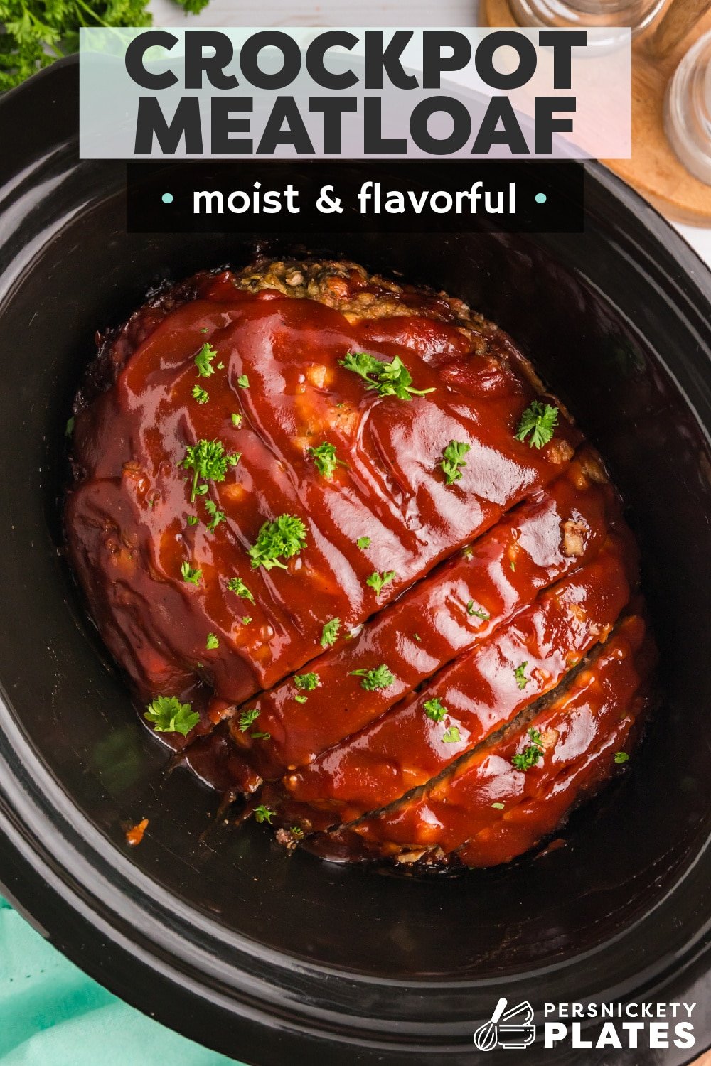 Slow-cooked deliciously seasoned meatloaf smothered in a sweet and tangy barbecue sauce, cooked until perfectly juicy and moist, with a caramelized outer crust, and then finished with even more glaze. This slow cooker meatloaf is an easy way to make a true comfort meal that'll be ready to serve with all your favorite sides any night of the week. | www.persnicketyplates.com
