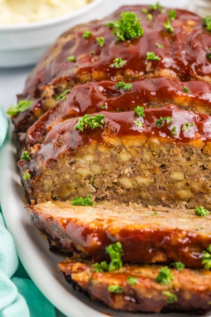 sliced meatloaf on a platter.
