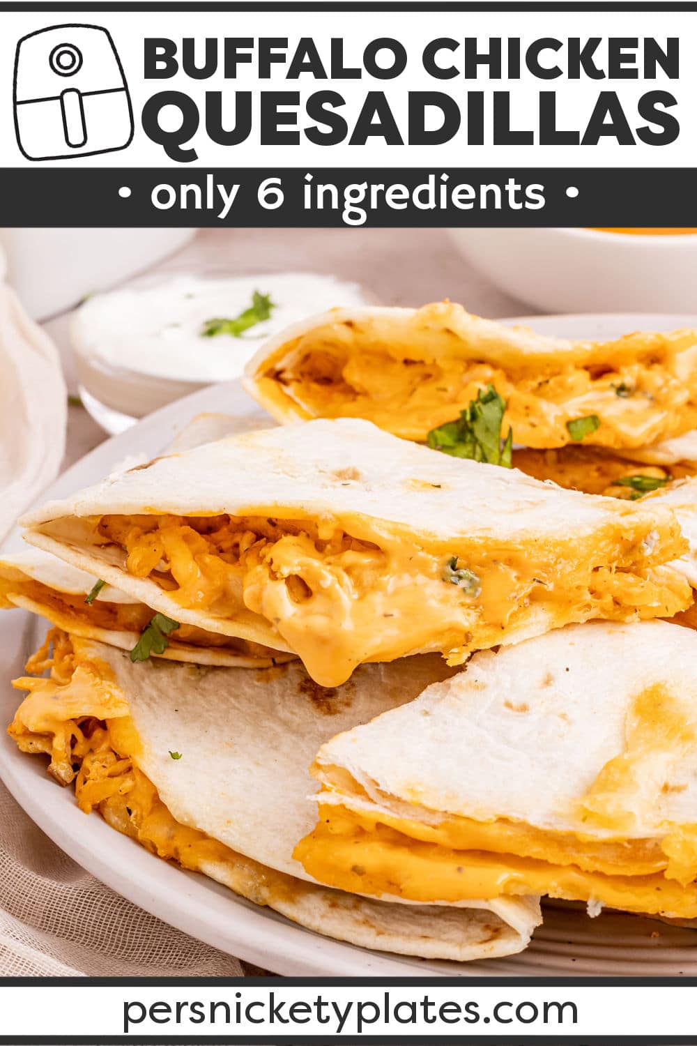 Air fryer Buffalo chicken quesadillas are made with shredded chicken smothered in tangy, spicy, buffalo sauce and cool creamy ranch dressing stuffed in a tortilla shell along with cheddar and blue cheese. They’re folded and air fried until crispy golden brown on the outside and melty, saucy, and delicious on the inside! | www.persnicketyplates.com