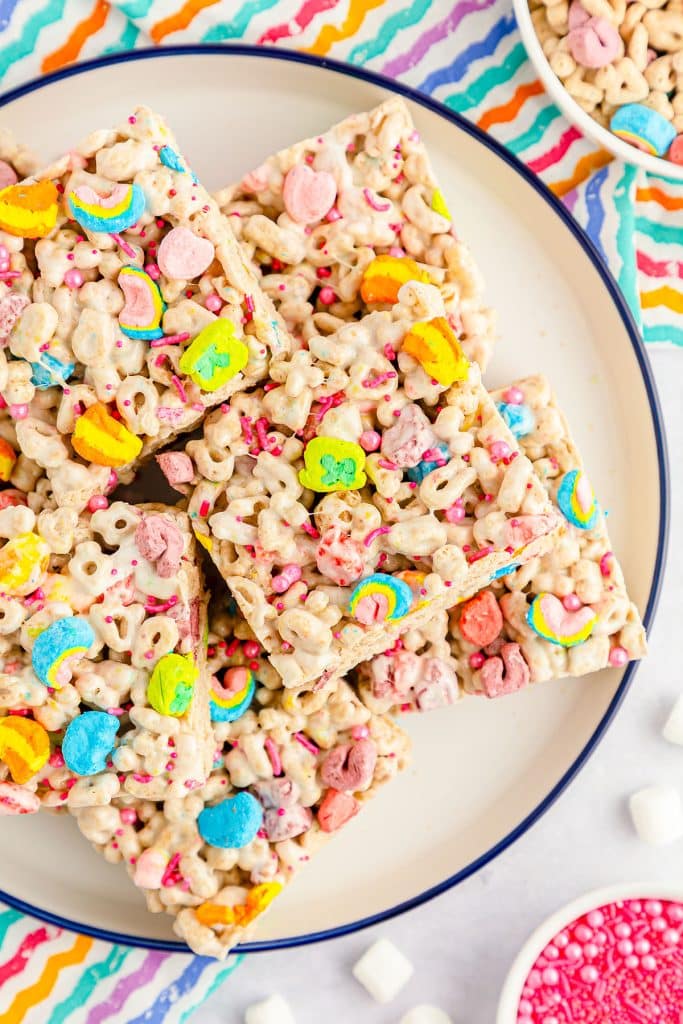 overhead shot of colorful lucky charms marshmallow treats on a plate.