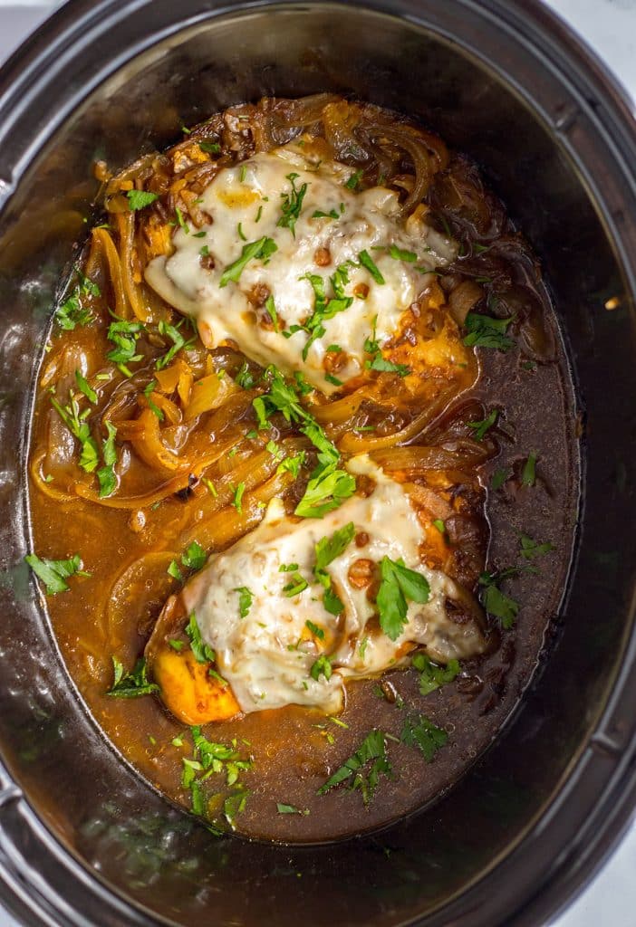 overhead shot of crockpot french onion chicken in a crockpot.