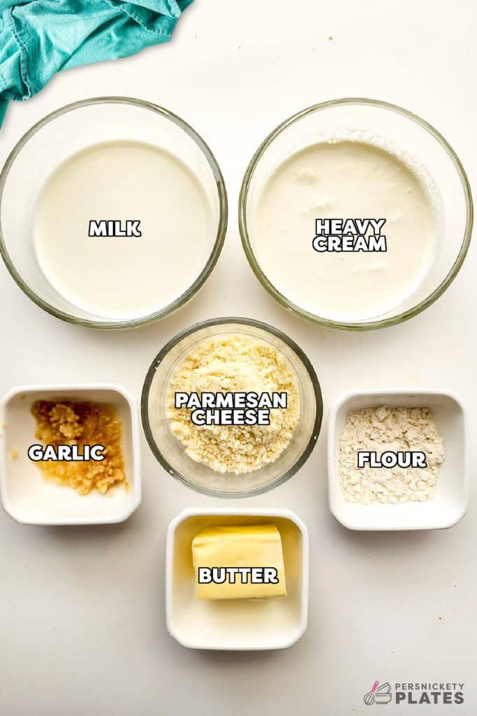 overhead shot of labeled ingredients in bowls to make homemade alfredo.