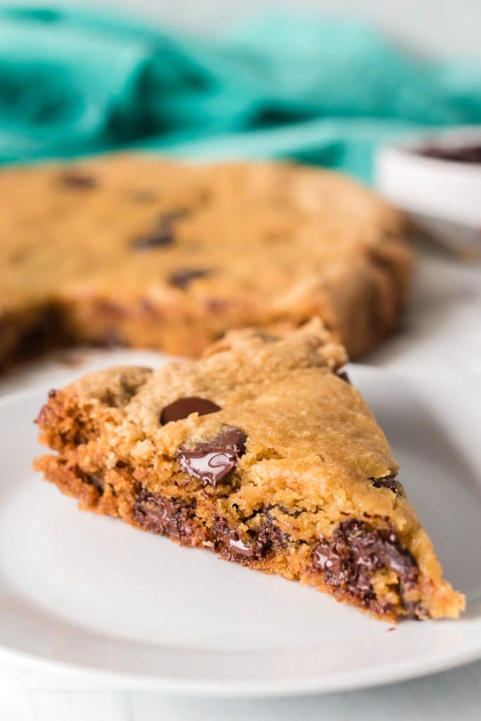 pie shaped slice of a giant chocolate chip cookie.