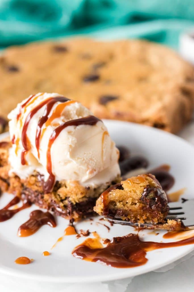bite of a chocolate chip cookie cake on a fork.