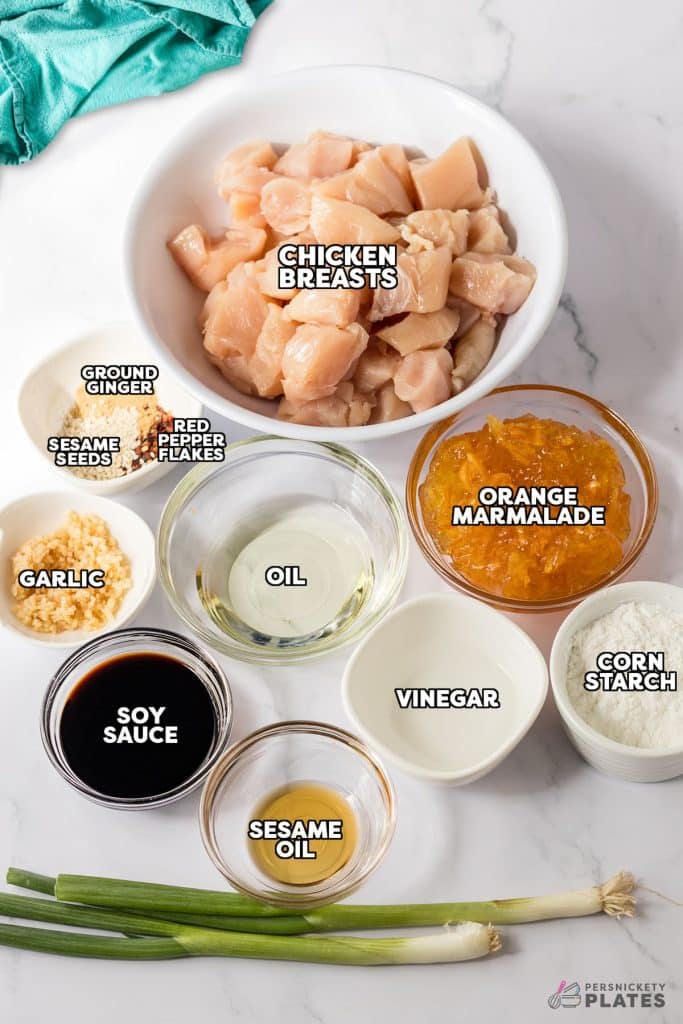 overhead shot of labeled ingredients laid out to make orange chicken.