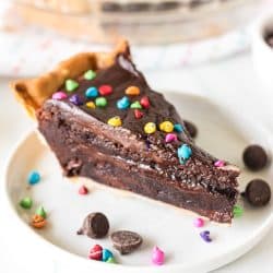 slice of cosmic brownie pie on a white plate.