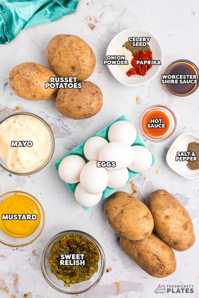 overhead shot of labeled ingredients laid out to make potato salad with eggs.