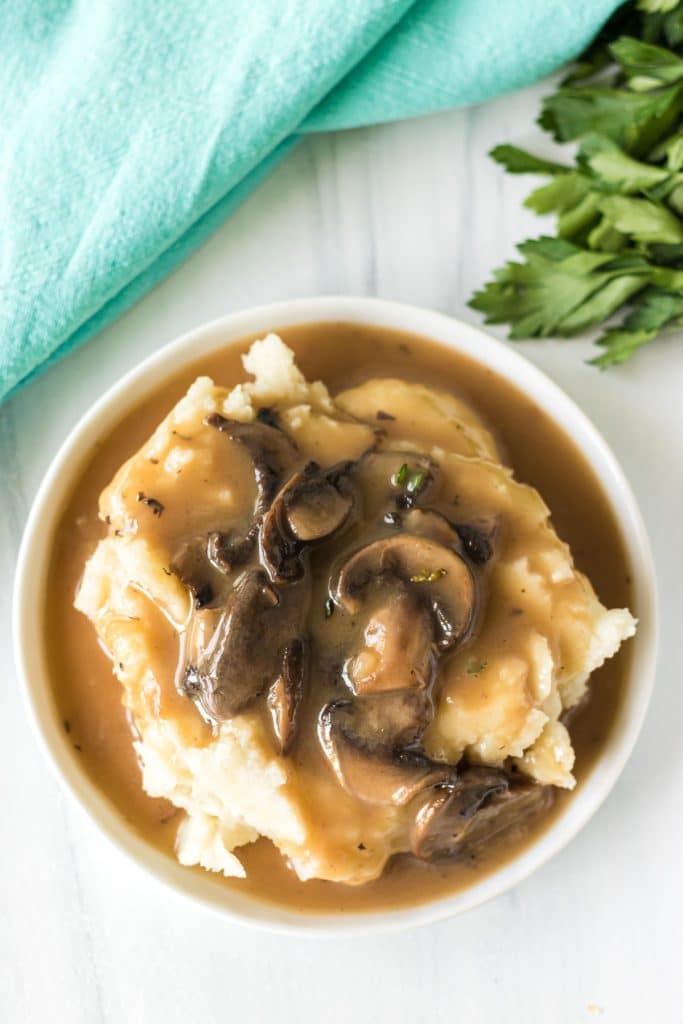 plate of mashed potatoes with mushroom gravy.
