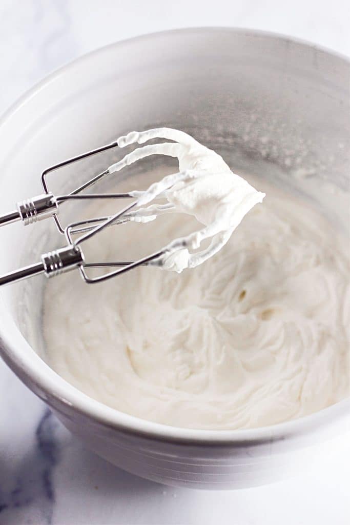 stabilized whipped cream on hand mixer beaters.