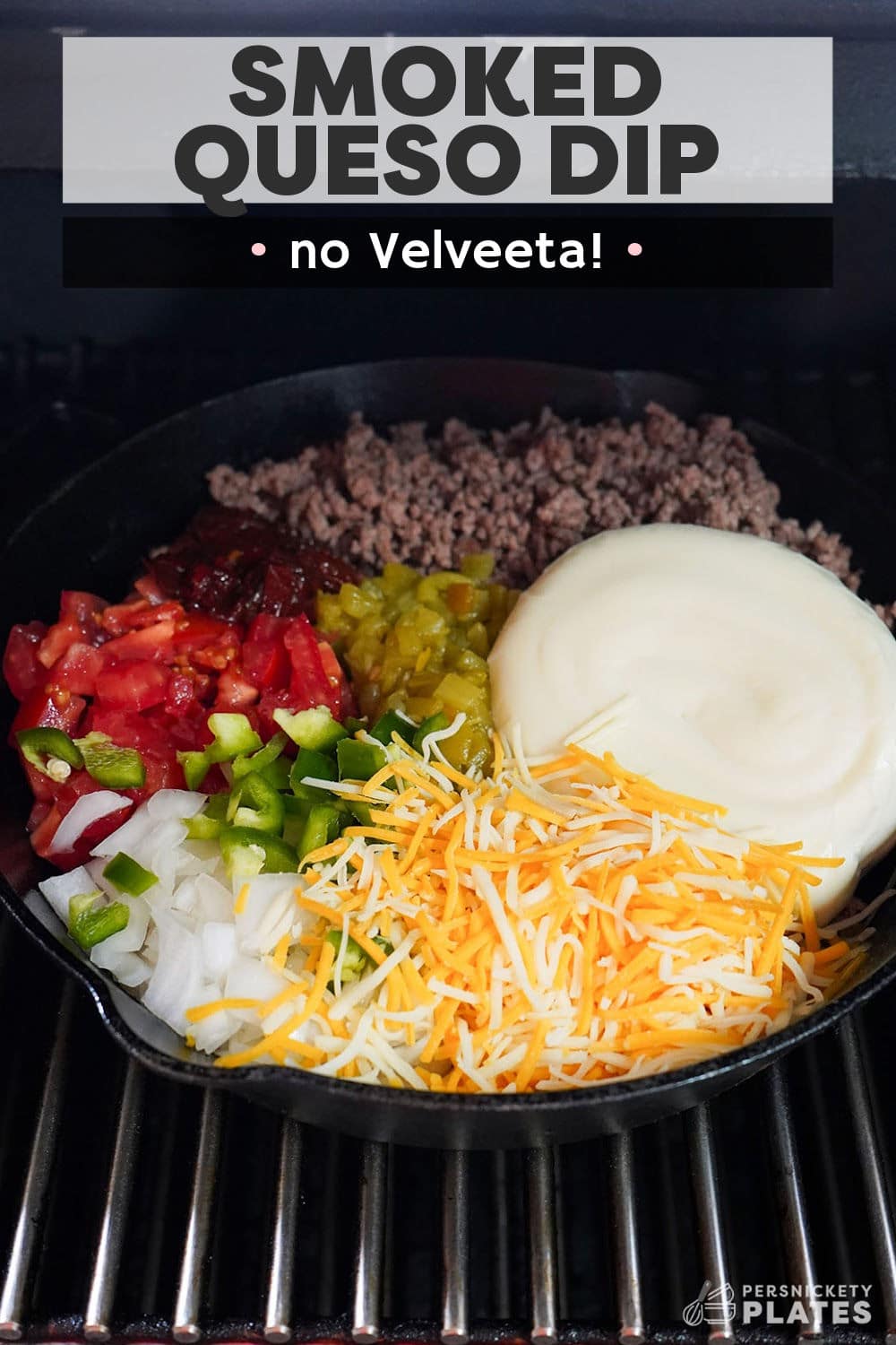 This smoked queso recipe with beef is made with two kinds of freshly grated real cheese and no Velveeta! Loads of ground beef, tomatoes, onions, and three kinds of peppers for heat are cooked low and slow in a flavor-infused smoker giving this ultimate queso dip tons of Mexican-inspired flavor. | www.persnicketyplates.com