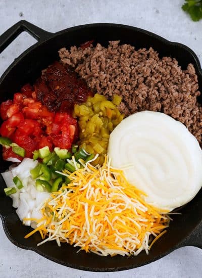 overhead shot of skillet filled with queso ingredients.