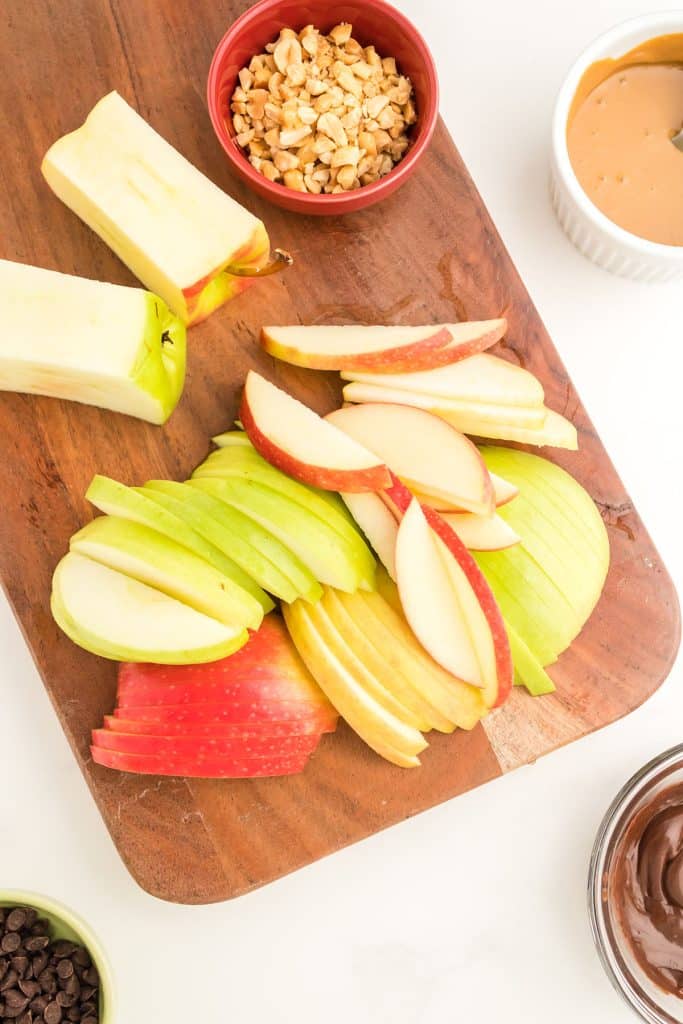 sliced apples on a cutting board.