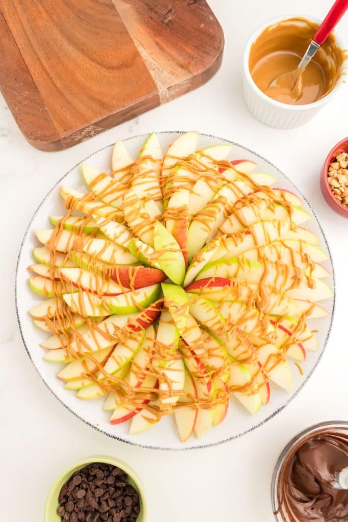 apple slices drizzled with peanut butter.