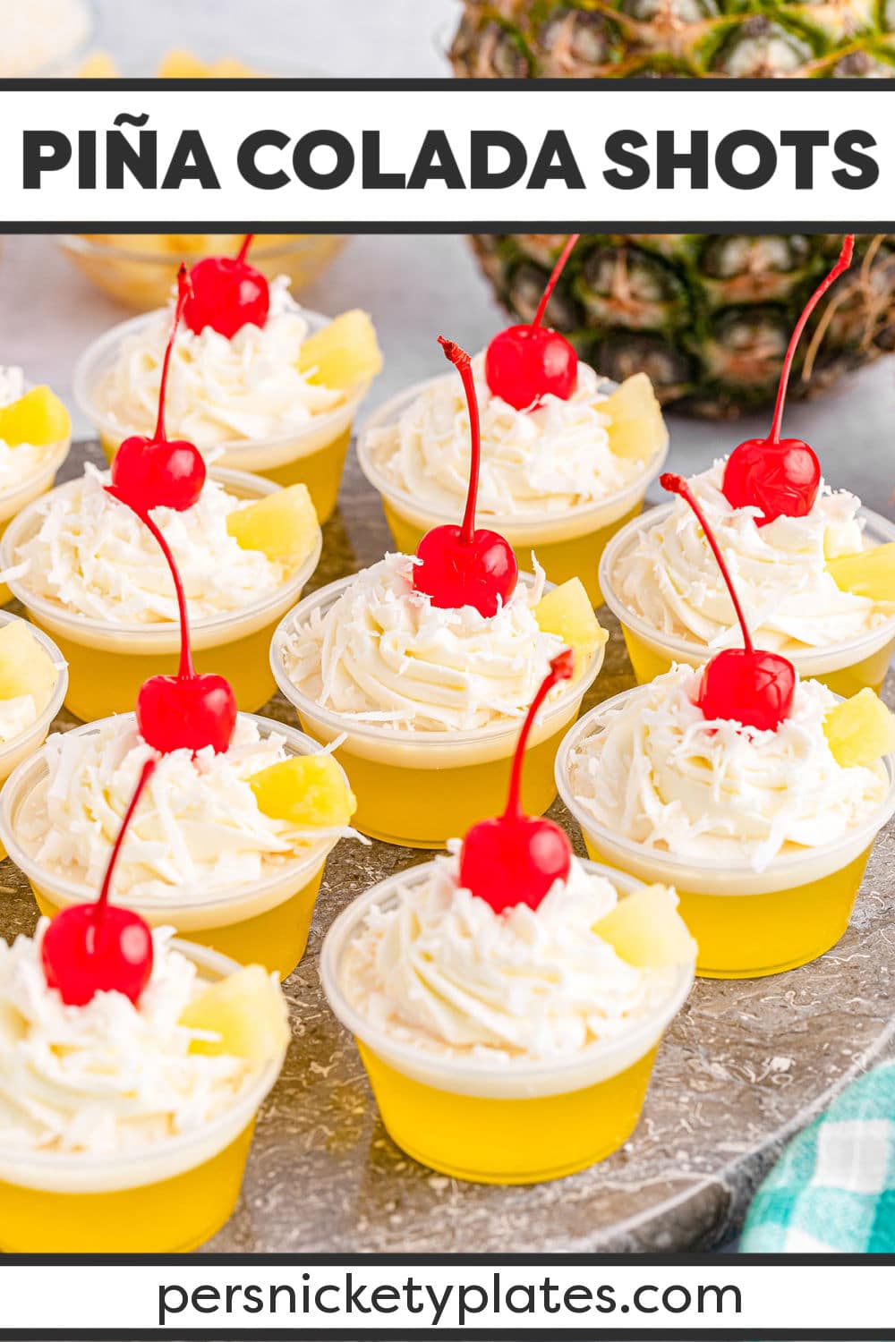 These Pina colada jello shots are a twist on everyone’s favorite beach vacation cocktail! Made with two distinct layers of yellow and white, we’re bringing pineapple flavors and coconut flavors together in one tasty treat! These fun jello shots are always a good idea when hosting any kind of party as a great way to combine a dessert and cocktail in one! | www.persnicketyplates.com