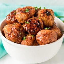 white bowl filled with firecracker chicken meatballs.