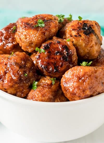white bowl filled with firecracker chicken meatballs.