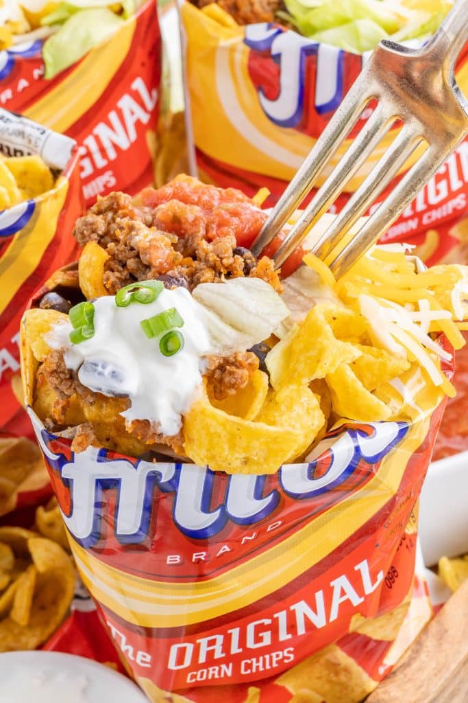 fork dipping into a frito bag walking taco.