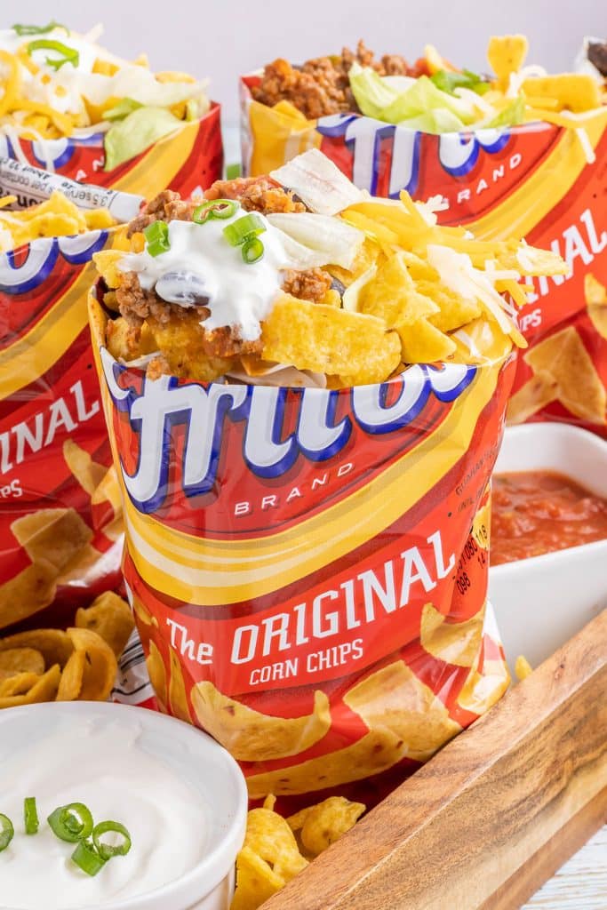 frito corn chip bag filled with taco toppings.