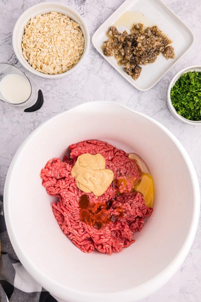 raw beef mixture in a mixing bowl.