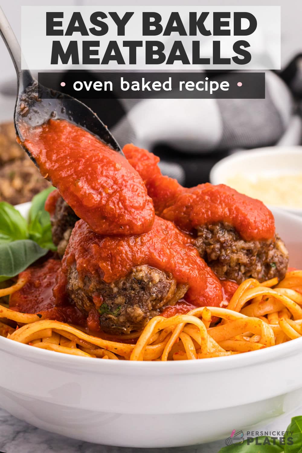 Easy Oven Baked Meatballs are juicy, tender, and super flavorful. These baked ground beef meatballs are ready in 35 minutes with no grease splatter to cleanup which makes them the perfect meal any day of the week. Serve them over pasta, as an appetizer, in a sandwich, or get ahead with your meal prep by doubling the batch and freezing some for later! | www.persnicketyplates.com