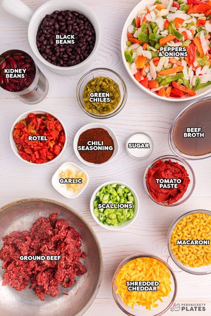 overhead shot of labeled ingredients laid out to make chili mac in the crockpot.