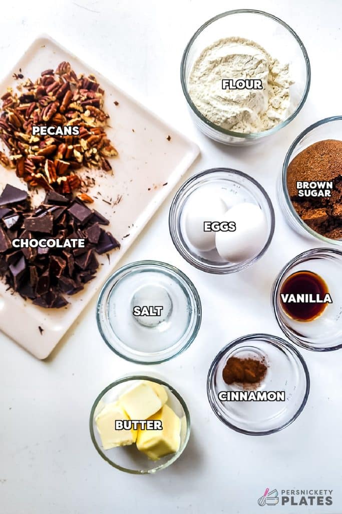 overhead shot of labeled ingredients laid out to make chocolate chip cookie bars.