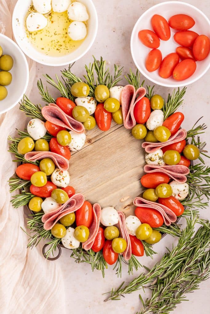 meats and cheese laid out in a wreath shape.