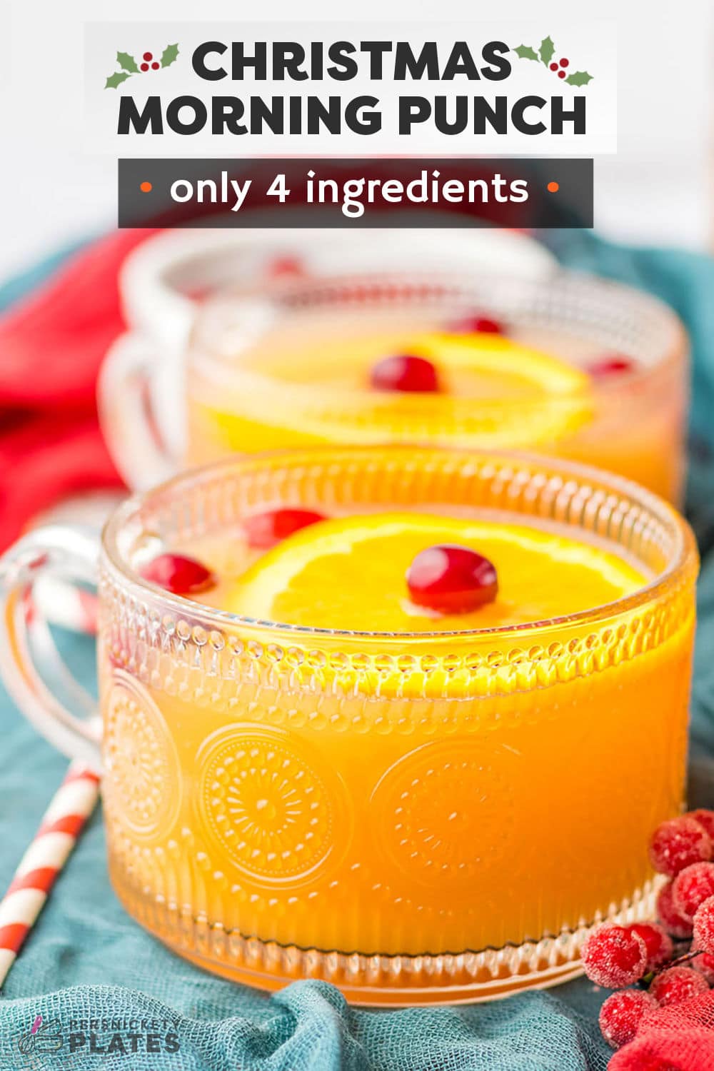 Presents from Santa aren't the only reason to get excited about Christmas morning! This family-friendly and festive Christmas morning punch recipe is a combination of pineapple juice, orange juice, cranberry cocktail, and ginger ale, garnished with cranberries and fresh orange slices, and the perfect way to get the holiday festivities off to a refreshing start! | www.persnicketyplates.com
