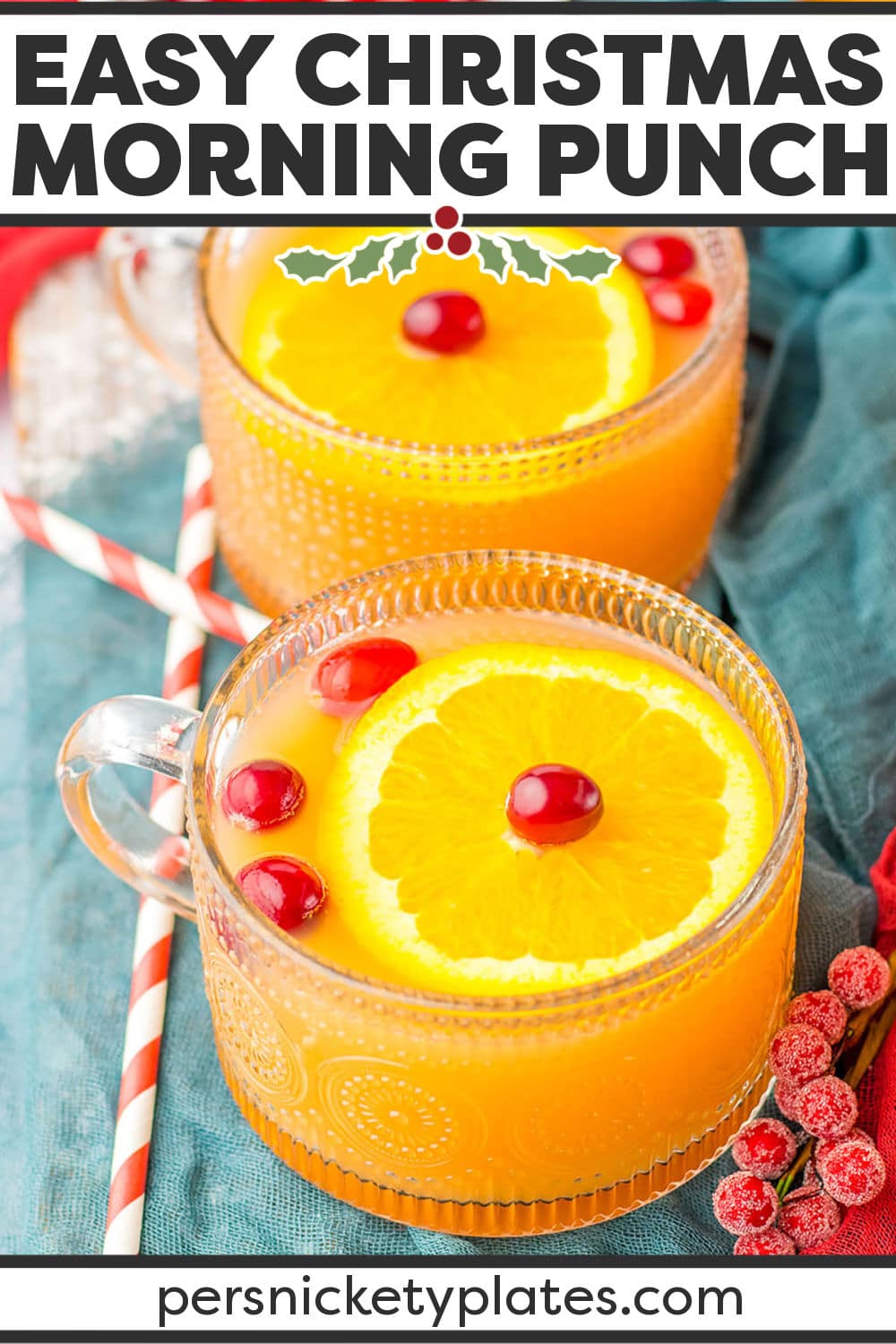Presents from Santa aren't the only reason to get excited about Christmas morning! This family-friendly and festive Christmas morning punch recipe is a combination of pineapple juice, orange juice, cranberry cocktail, and ginger ale, garnished with cranberries and fresh orange slices, and the perfect way to get the holiday festivities off to a refreshing start! | www.persnicketyplates.com