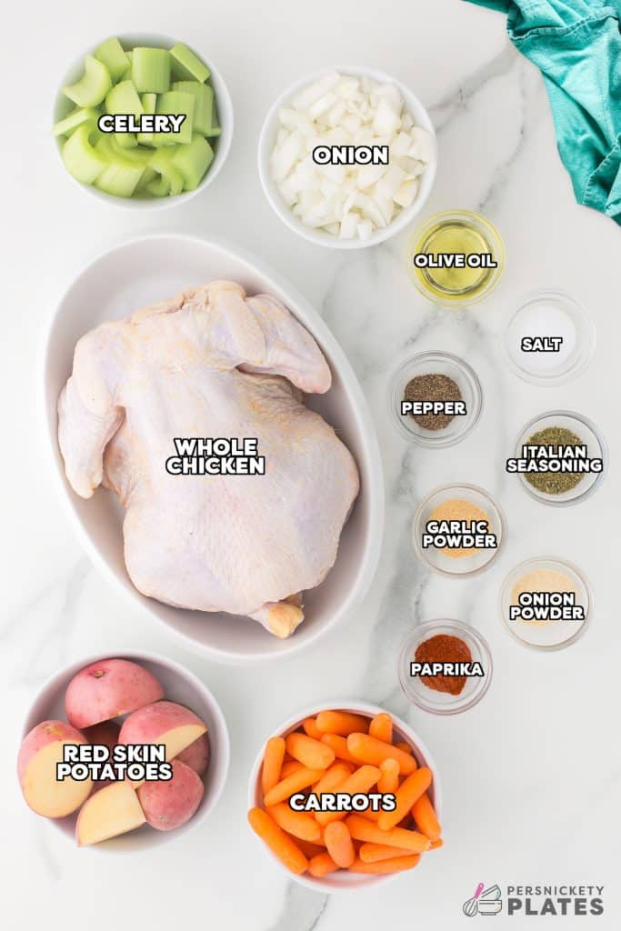 overhead shot of labeled ingredients laid out to cook a whole chicken.