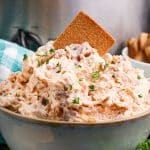 bowl of reuben dip with a rye chip stuck inside.