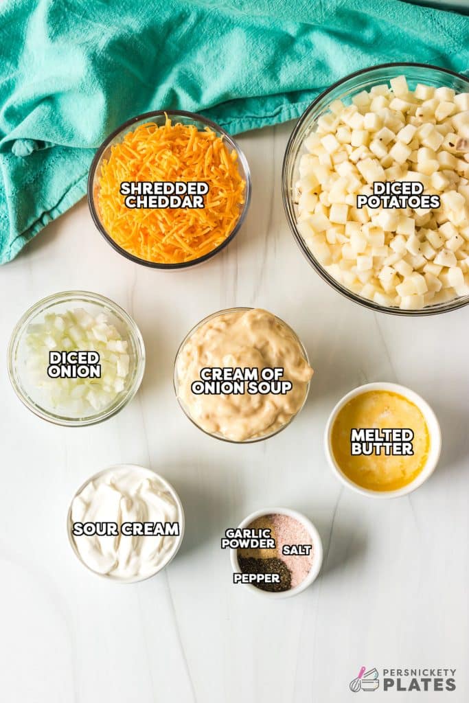 overhead shot of labeled ingredients laid out to make cheesy potatoes.