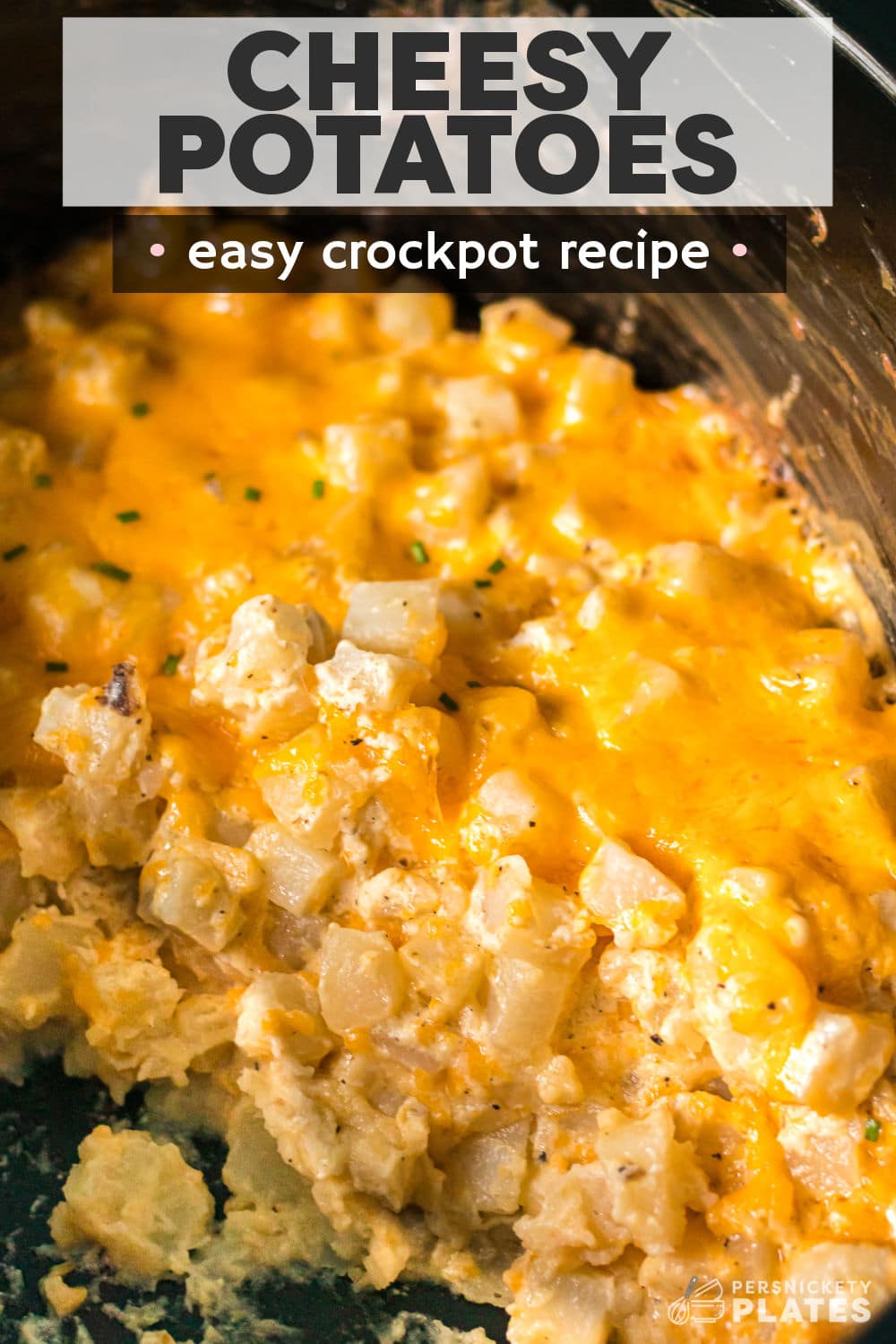 Slow Cooker Cheesy Potatoes is an incredibly simple side dish that is perfect for a holiday meal but it's easy enough to serve for a simple weeknight family dinner. | www.persnicketyplates.com