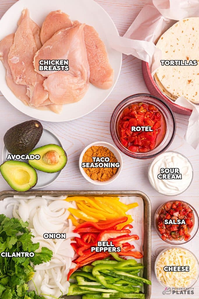 overhead shot of labeled ingredients laid out to make chicken fajitas.
